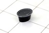 A Picture of product 106-501 SOUFFLE CUP 2OZ BLK W/LID. ELLIPSO OVAL SHAPED MICROWAVEABLE COMBO PACKED.