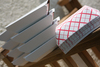 A Picture of product 193-376 SCT Southland™ Red Check Food Trays. #300 (3 lb.). 7-1/5 X 5 X 2 in. 250/sleeve, 2 sleeves/case.