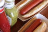 A Picture of product 251-142 SCT Hot Dog Food Trays. 7 X 2.75 X 1.5 in. White. 250/sleeve, 4 sleeves/case.